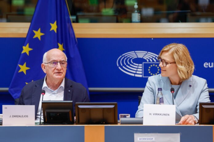 Javier Zarzalejos and Henna Virkkunen seated side by side at the committee podium with an EU flag behind them